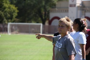 Shelby Keck Chico State women's coach Kim Sutton directs the players to move the ball down field during practice at the soccer stadium Wednesday.