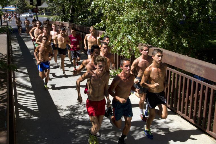 Carter Caldwell
Kyle Medina, front center, and other cross-country athletes take a run through the streets of Chico as preparation for the upcoming season.