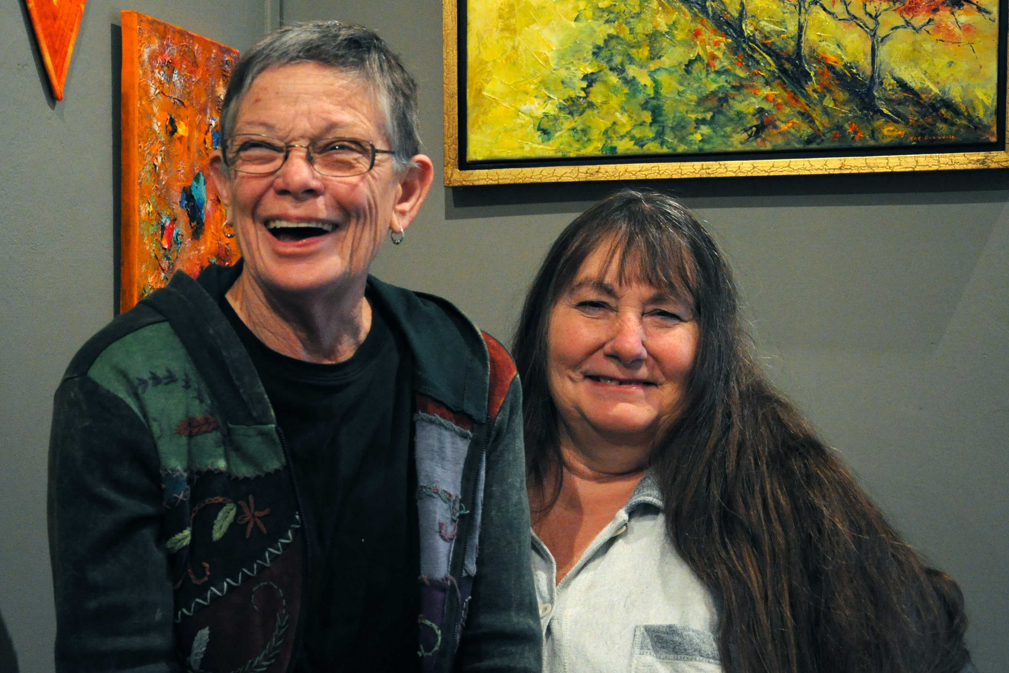 Erin Wells (left) and Debra Simpson (right) banter as they enjoy the current art hung up on the gallery located on orange street.Photo credit: Annie Paige