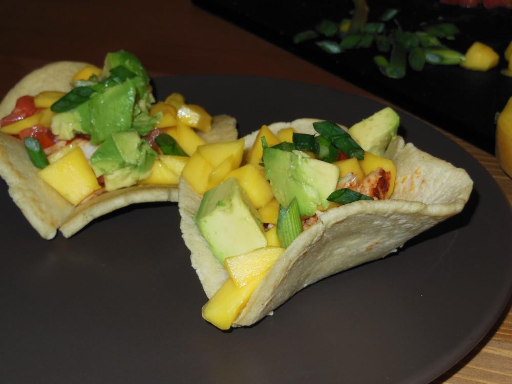 Make tortilla bowls from scratch and fill them with spicy tilapia and a sweet mango salsa for a fresh take on traditional tacos.Photo credit: Christina Saschin