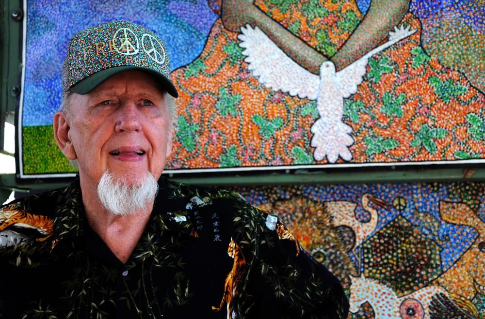 Norm Dillinger, 76, creates striking paintings using the pointillistic style of perfectly placed acrylic dots. His house is open to guests who want to brighten up their day with his creations, ranging from painted sculptures to canvases and cars.Photo credit: Annie Paige