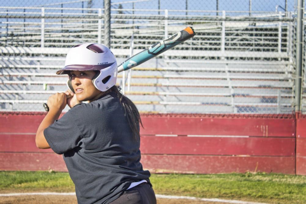Alex Molina, senior pitcher, gets ready to bat during practice. Photo credit: Maisee Lee