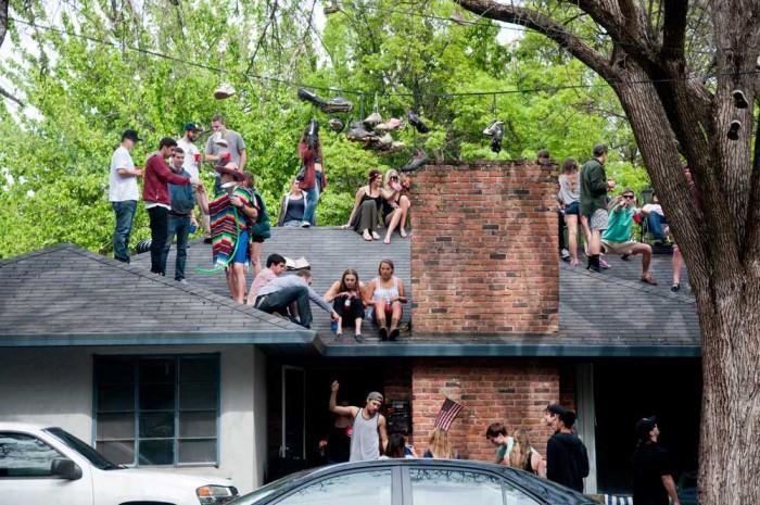 Students party on a roof on Chavez in 2014. Cesar Chavez Day has been observed by Chico State since 2001. Photo by Annie Paige.