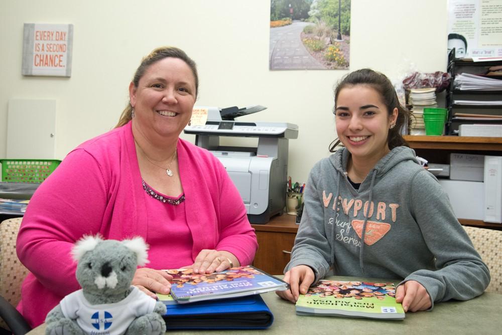 CADEC program director Trisha Seastrom looks over training materials with Sofia Rodriguez, a Chico State student and peer educator.Photo credit: Matthew Vacca