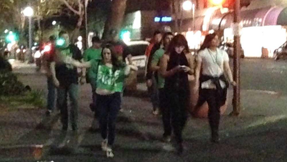Party-goers walking downtown on evening of St. Patrick's Day in Chico. Photo credit: Christine Lee