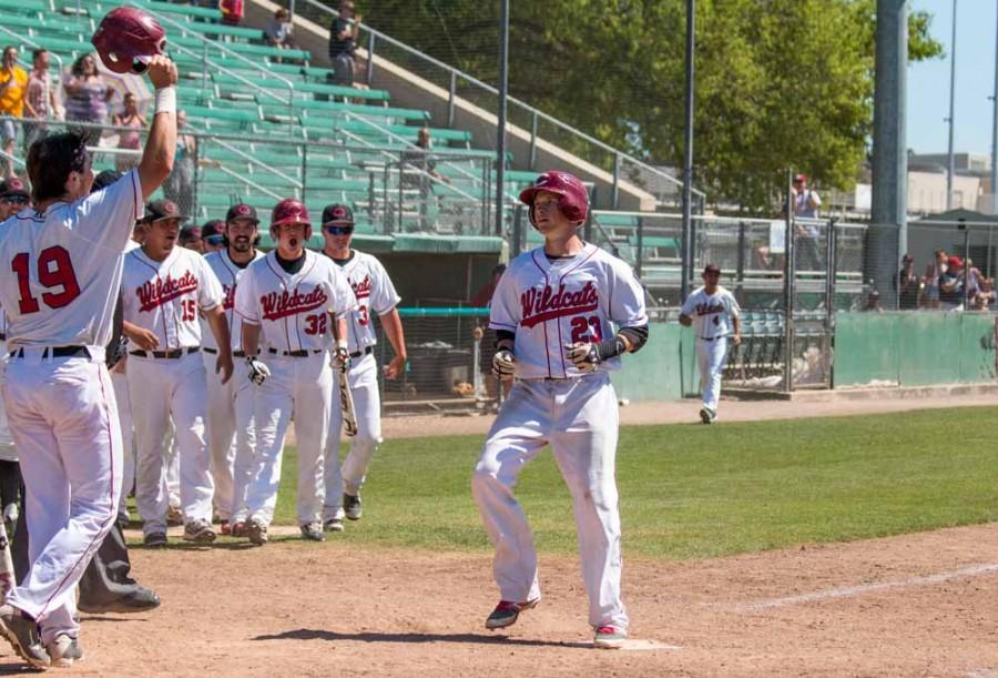 Eric Angerer (left) congratulates Ryan McClellan (center) after a home run to tie the game Sunday against Cal State Dominguez Hills. Photo credit: Grant Mahan