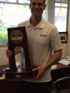 Head Coach Greg Clink holds the NCAA West Regional Trophy. Photo credit: Angelo Boscacci