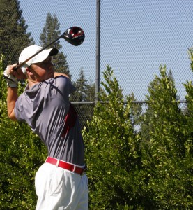 Alistair Docherty pounds a shot on the opening hole at Butte Creek Country Club last season. Orion file photo.