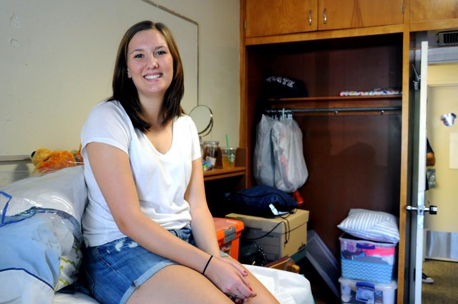 Jensen Rader, an incoming freshman communication studies major, settles into her room on the first floor of the Lassen dormitory on thursday afternoon. Photo credit: Annie Paige