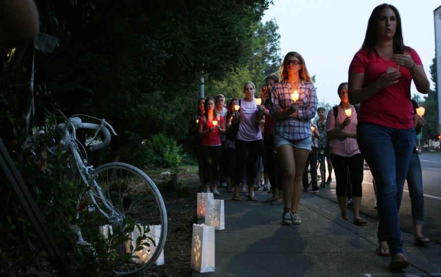 Kristina Chesterman supporters walk to the scene of her accident with candles Sunday, September 22, 2014 by Nord Ave. Chico. Photo by John Domogma.