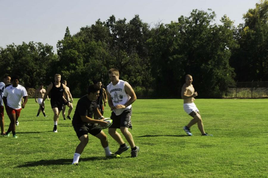 The rugby team skirmishing during its preseason. Photo credit: Brandon Foster