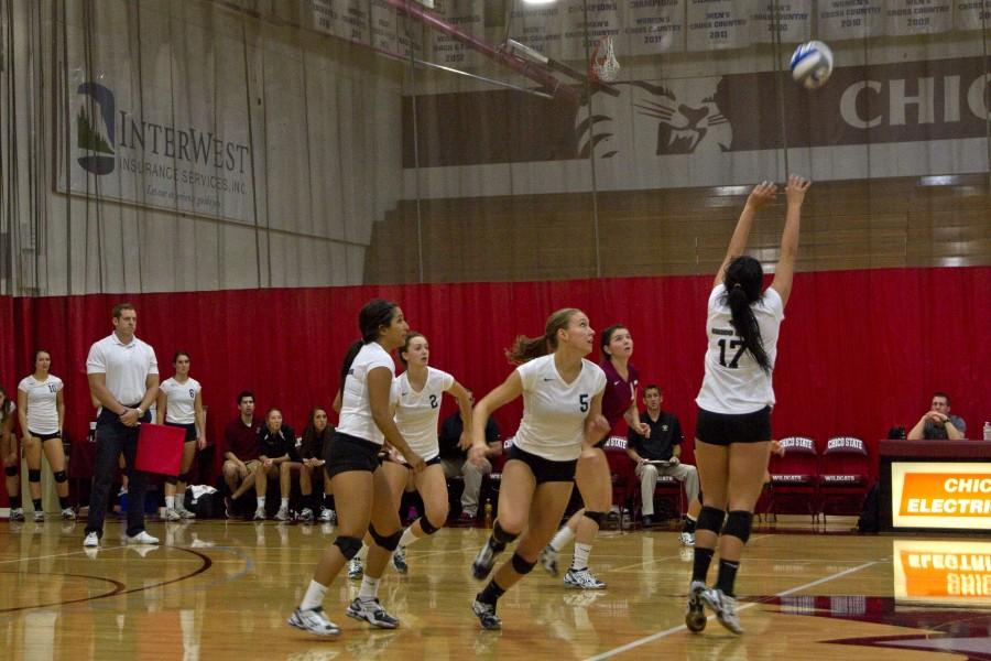 Lindsay Quigley, second from right, sets up for a return in a set earlier last season. Orion file photo.