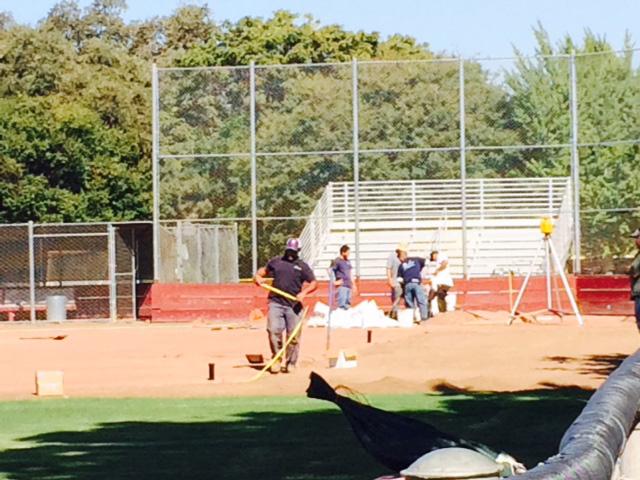 Construction workers make improvements to the Chico State softball field. Photo credit Angelo Boscacci.