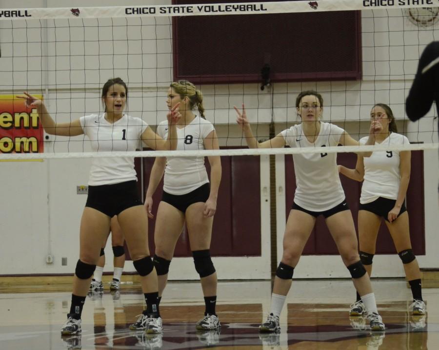 Junior middle hitter Kristyn Casalino, left, sophomore outside hitter Shannon Boling, left center, junior outside hitter Ellie Larronde, right center, and freshman middle hitter Anuhea Kaiaokamalie prepare for a serve in a game last year. Orion File photo