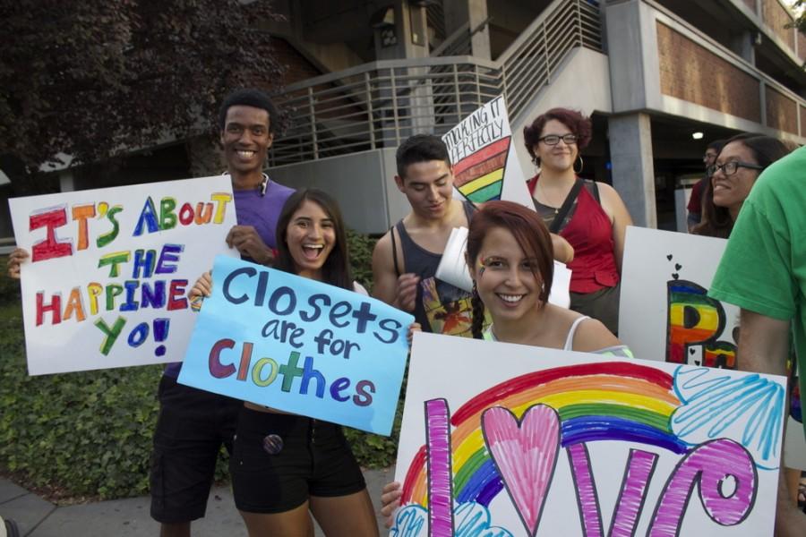 Students show their support in the march by holding signs and sharing their views. 