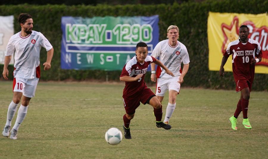 Freshman forward Patrick Lee sprints to the ball on September 12, 2014 at the Chico State Wildcat soccer field. Photo credit: John Domogma