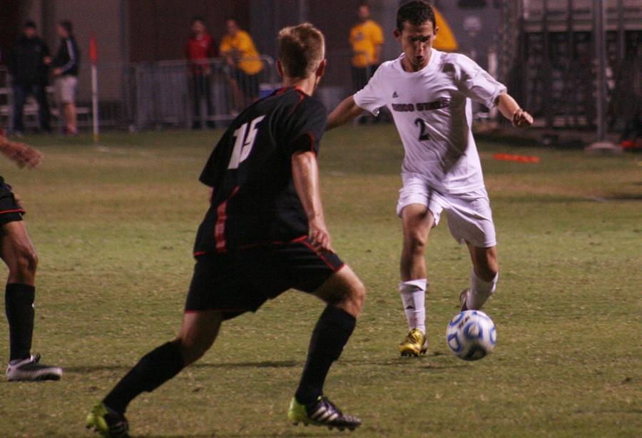 Wildcat Defender Kenny Rosecrance attempts to center the ball in the box at Chico State Friday October 17, 2014 against CSU East Bay Pioneers. Photo credit: John Domogma