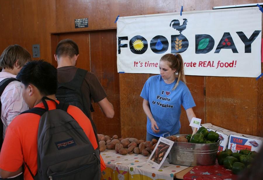 Jena Roof, a nutrition major, gives students vegetables at Central Middle School in Oroville Friday. Photo credit: John Domogma