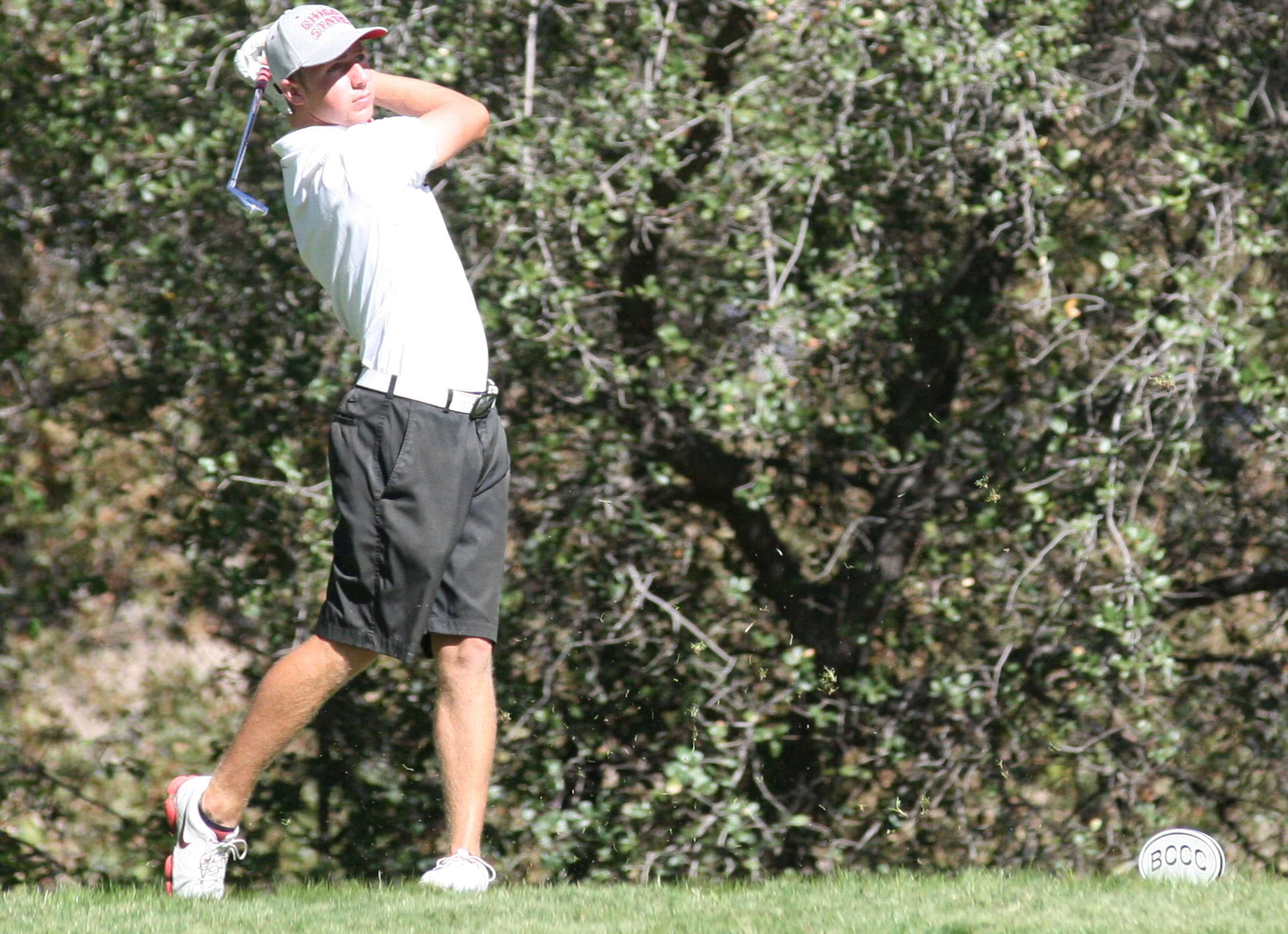 Chico State golfer Alistair Docherty watches his shot. Photo credit: John Domogma
