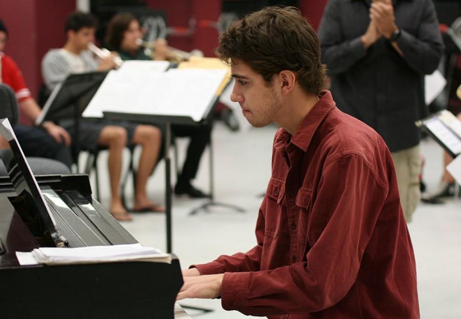 Daniel Michelson, junior mechanical engineering major, intently plays piano during the Jazz X-Press rehearsal Oct. 14 at the Performing Arts Center. Photo credit: John Domogma