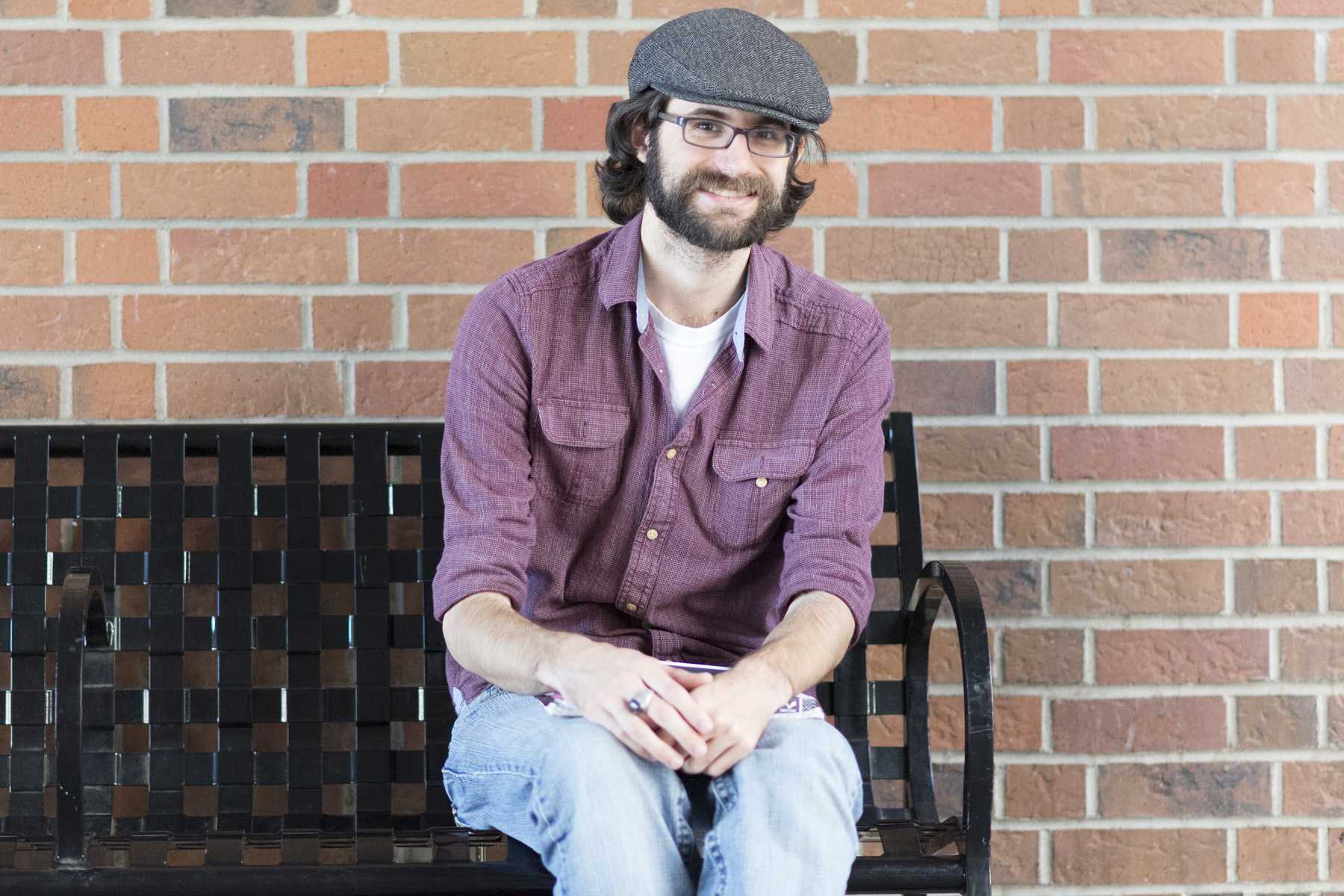 Dane Lamoreaux, senior English education major, discusses how silly videos online makes him laugh. Photo credit: Matthew Vacca