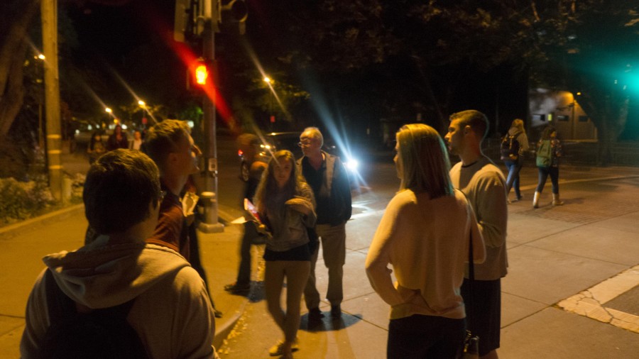 Students and community members gather on Legion Avenue to look for areas that could be safer and better lit. Photo credit: Brandon Foster