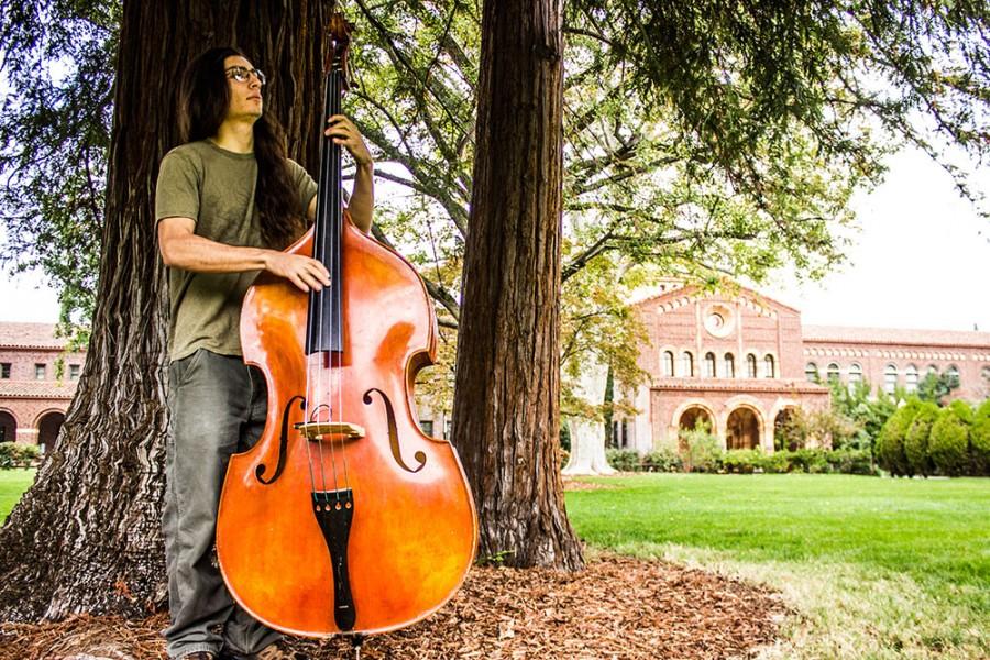 Chico State senior recording arts major Alex Montes de Oca started playing the upright bass about three years ago, though he started on a five-string electric in high school. Photo credit: Chelsea Jeffers