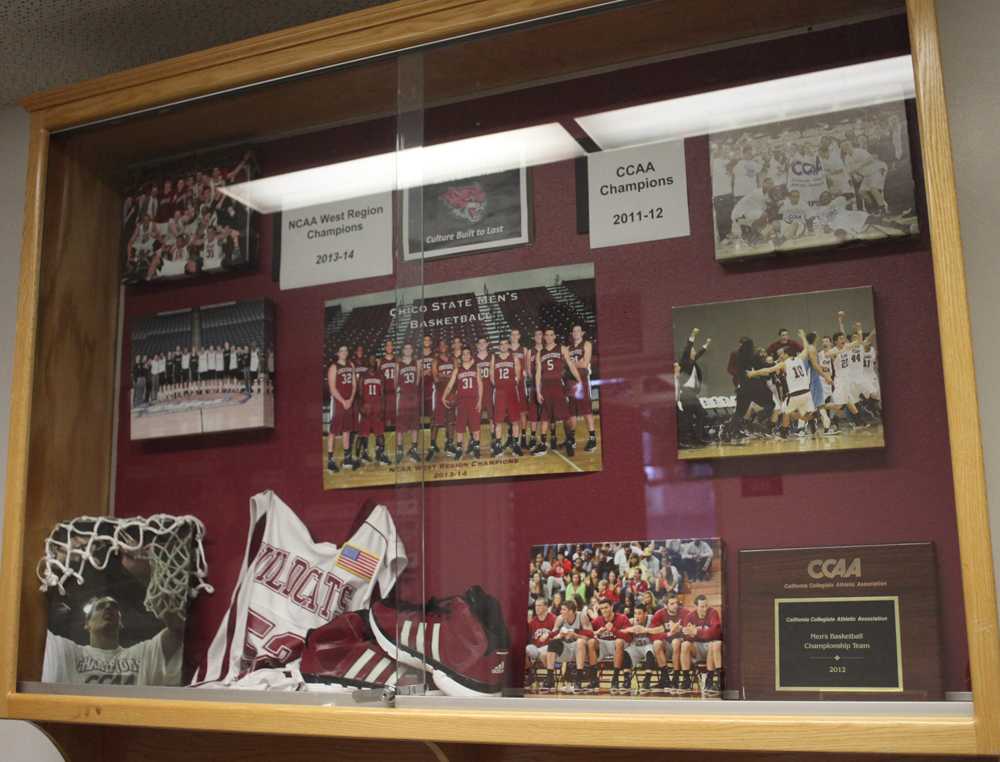 A display case in front of the Chico State men's basketball team's office inside Acker Gym highlights awards and memorabilia. Photo credit: John Domogma