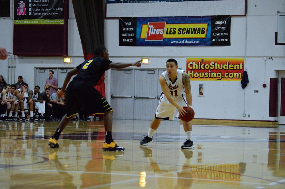 Chico State's Mike Rosaroso being guarded by Los Angeles State's Chris Martin on Jan 30. Photo credit: Caio Calado