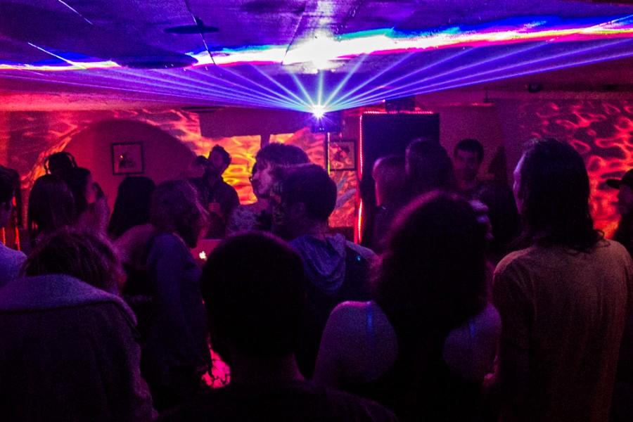Lights shine over a dance floor.