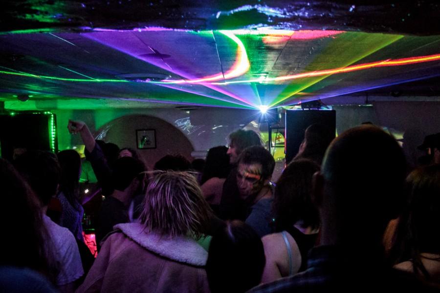 Lights shine over a dance floor.