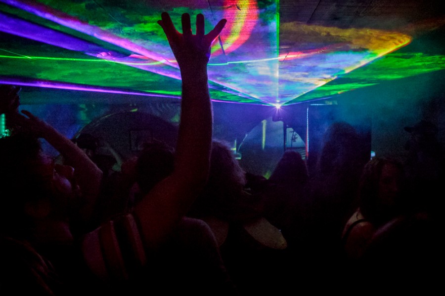 Lights shine over a dance floor.