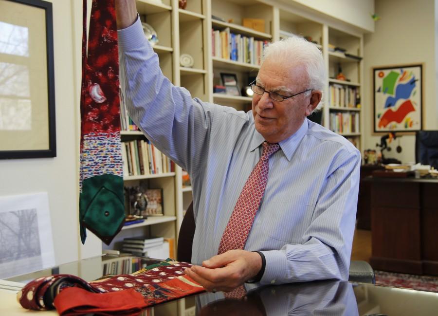 Chico State President Paul Zingg holds up one of the many ties from his extensive collection. Zingg has been president of the university since 2004. Photo credit: Malik Payton