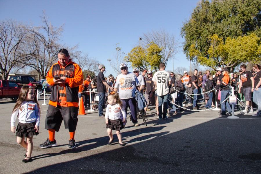 Orlando Raygoza and his two daughters make their way inside the Arron Ray Clark Memorial Field House where the SF Giant's three World Series trophies are displayed, Saturday, Jan. 31, 2015. Photo credit: Trevor Ryan