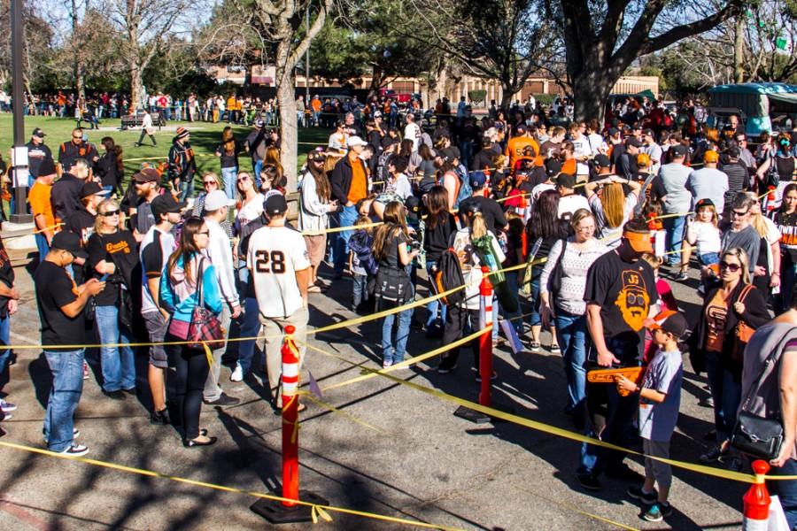 Hundreds of Butte County residents line up to get pictures with the SF Giant's World Series trophies. The 3 trophies were on display on Saturday, Jan. 31, 2015 at the Arron Ray Clark Memorial Field House. Photo credit: Trevor Ryan
