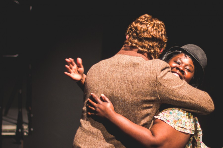 Award winning professor and event organizer Dr. Tracy Butts hugs former student Dylan de Wit at the annual Rent Party, Feb. 12 2015, in the Performing Arts Center. Photo credit Trevor Yale Ryan