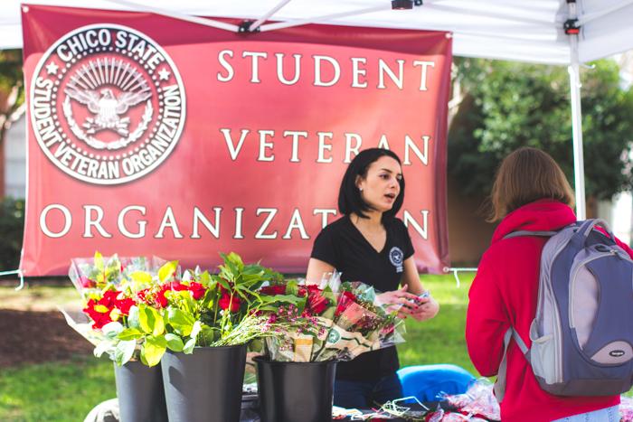 Chico State student Hazel Rodriguez, veteran and vice president of the Student Veteran Organization, helps sell roses and bags of candies in the gauntlet at Chico State, Feb 13, 2015. Photo credit Trevor Yale Ryan