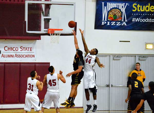 Chico States Isaiah Ellis jumps for a rebound against Cal State L.A.s Andre McPhail on Friday. Ellis is averaging six points per game but recently tied his season high of 14 points against Cal State East Bay on Jan. 23. Photo credit: Caio Calado