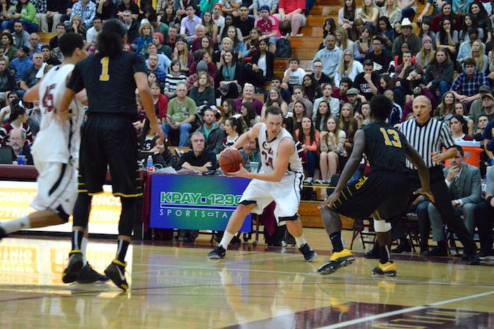 Chico States Drew Kitchens faces a Cal State L.A. opponent in a game on Jan. 30 at Acker Gym. Photo credit: Caio Calado