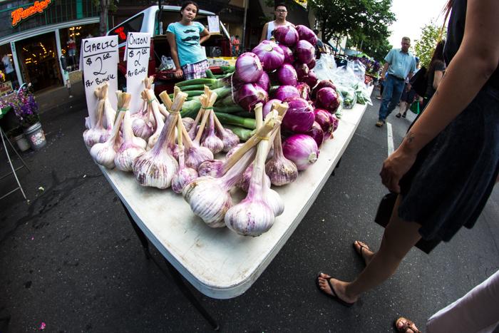 Onions and garlic for sale at the Farmers Market. Photo by Trevor Ryan