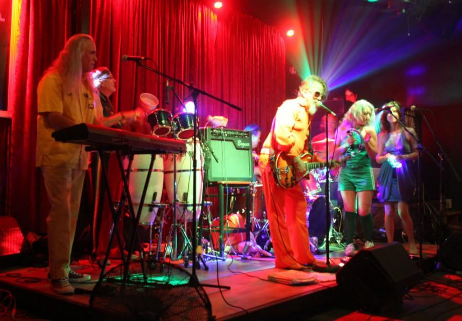 From left: Greg Spont, keys; Jerry Morano, congos; Scott, drums; John McKinley, lead vocalist/guitarist; and Susan Guevara and Cherianne Brandt Pollastrini rock the audience at The Maltese on Saturday August 22. Photo credit: John Domogma