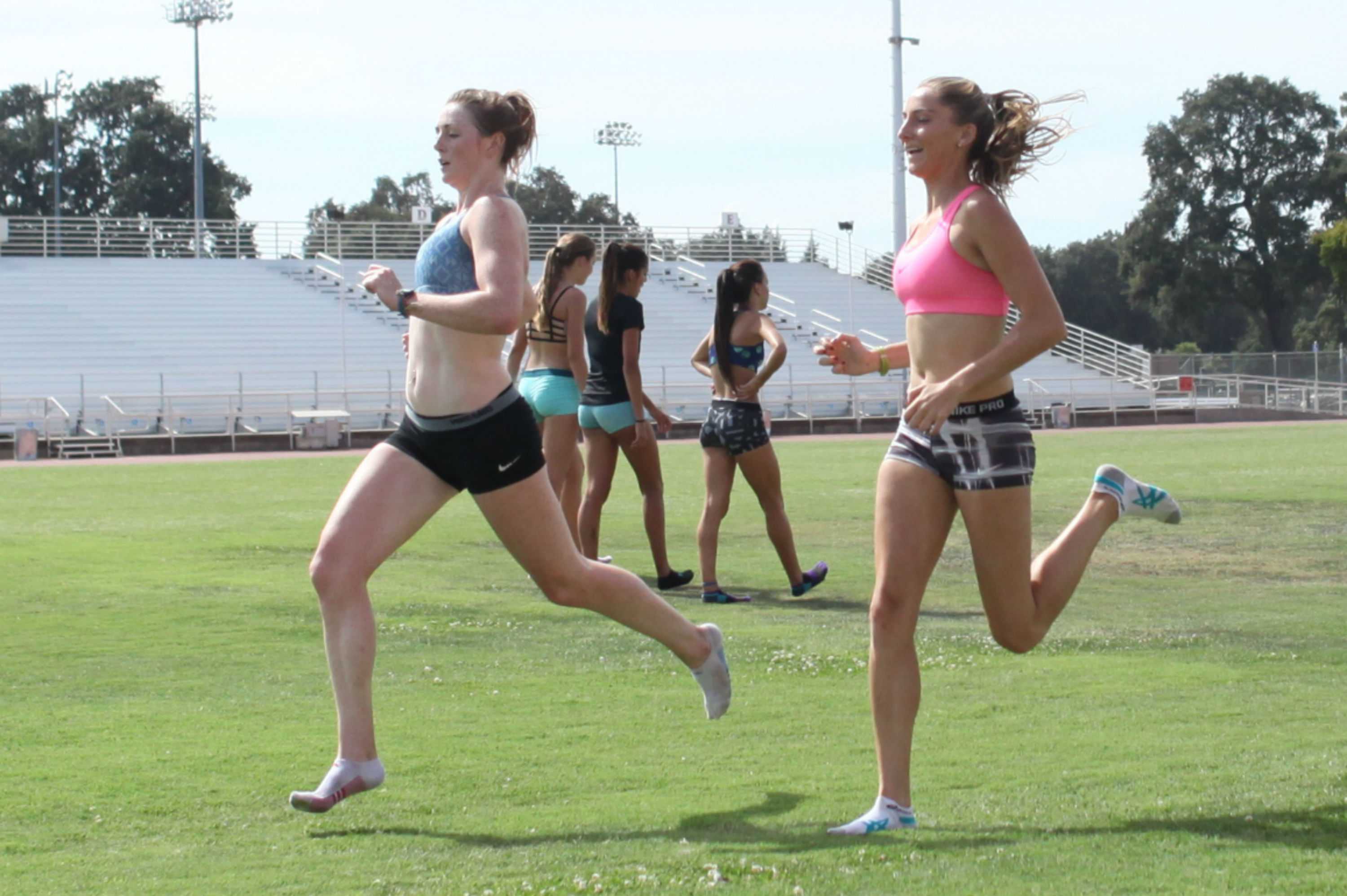 Kody Atkins and Nicole Anthony run during practice on Wednesday before hitting the weight room. Photo by John Domogma.
