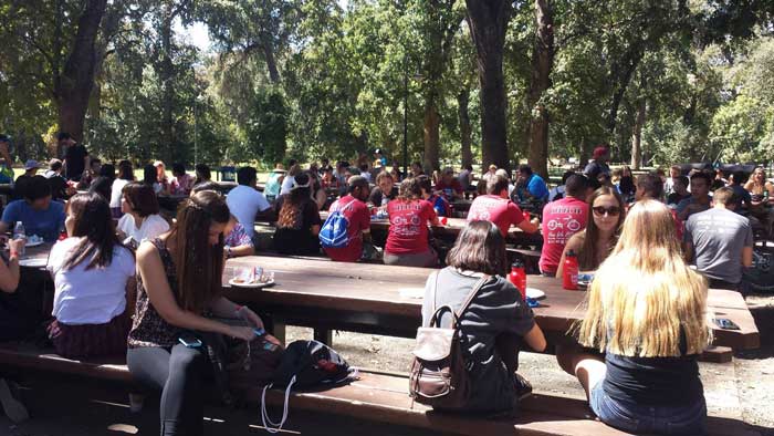 Chico State students enjoy free Bear burgers on their Labor Day weekend at One Mile. Photo credit: Kindra Robinson