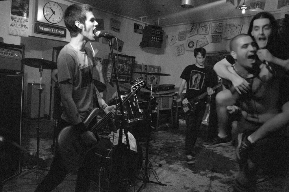 (From left) Bryan, bassist; Miles, guitarist and  Tommy, lead vocals with support from the 
drummer of Tri-Lateral Dirts Commission perform their most popular song, Get Hurt/Burn Out. Photo credit: Grant Casey