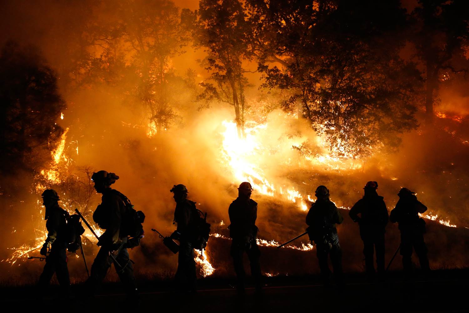 Multiple fire fighters flee to the hills of destruction caused by the Valley fire. Photo courtesy of NBC.