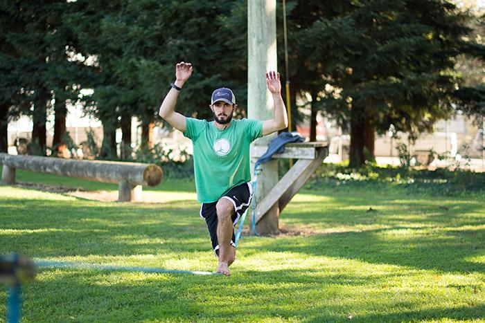 Riley Cox demonstrates perfect balance as he lunges across a slackline. Photo credit: Alicia Brogden