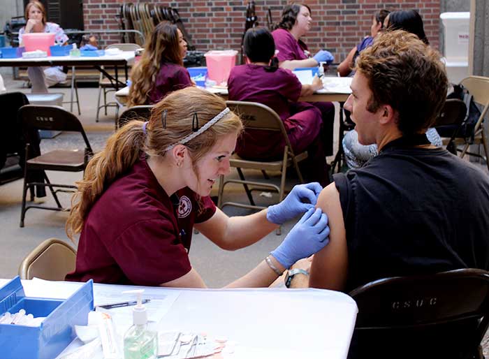 With flu season appraoching, nursing students are providing vaccinations to students in hopes that they will not contract the virus. Photo credit: Kiana Alvarez