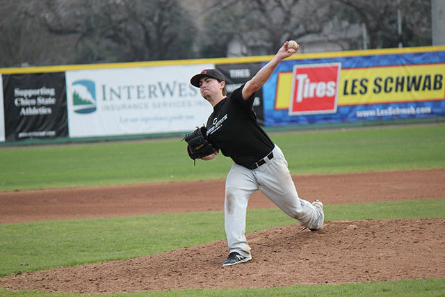 Senior pitcher AJ Epstein pitches the ball during a scrimmage on Jan. 21. Photo credit: Lindsay Pincus