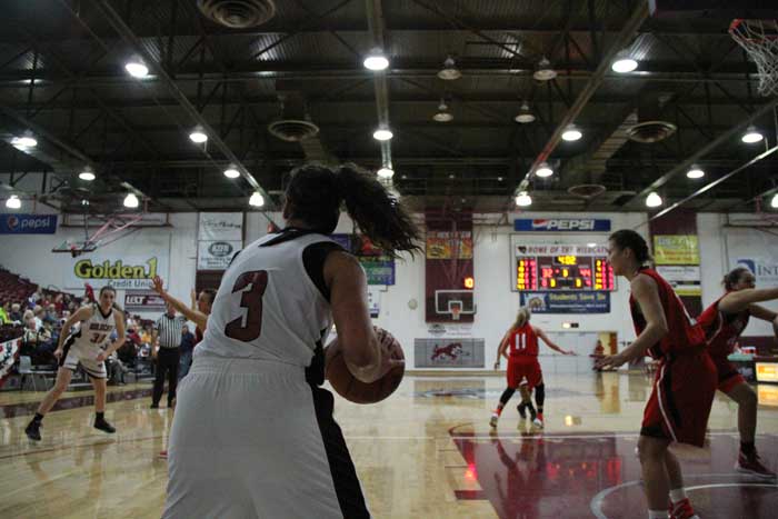 Sophomore Whitney Branham inbounds the ball against Cal State East Bay in a game on Feb. 5. Photo credit: Jacob Auby