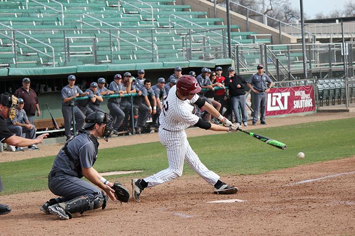 Junior infielder Case Bennett makes contact in a game against Academy of Art on Feb. 12. Photo credit: Lindsay Pincus